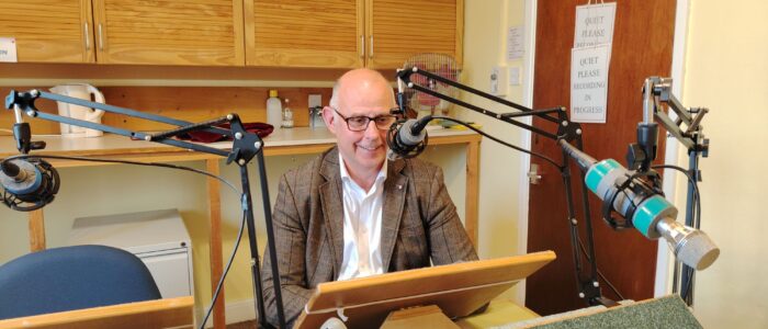 Cllr Stuart Dark recording a message Councillor Stuart Dark is seated in front of a lectern in our recording studio with a microphone positioned ready to catch his message for The Mardler.